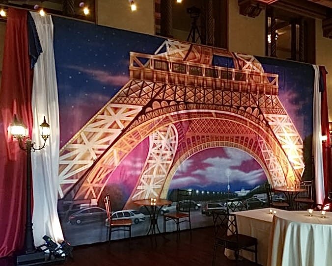 Large Eiffel Tower scenic backdrop for a Paris themed event