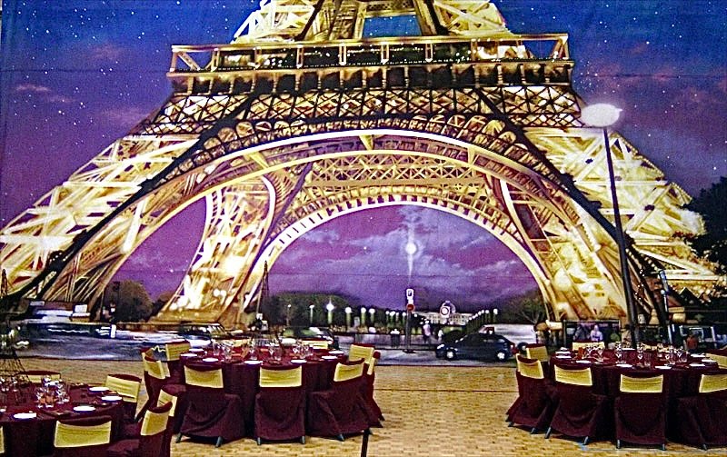Eiffel Tower backdrop in a ballroom during an event