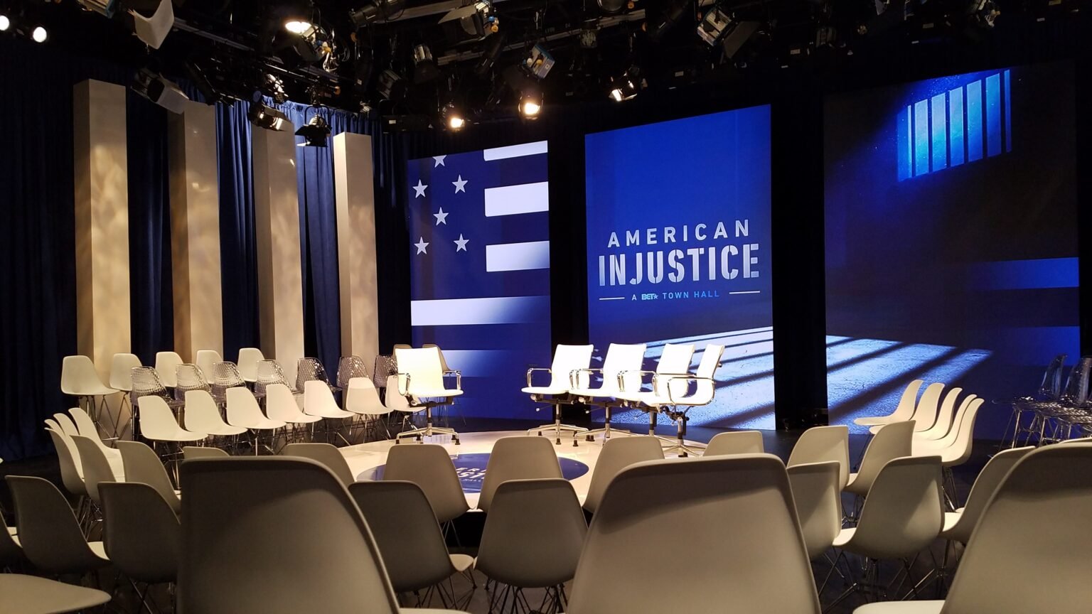 Custom broadcast stage set with columns and an LED American flag wall